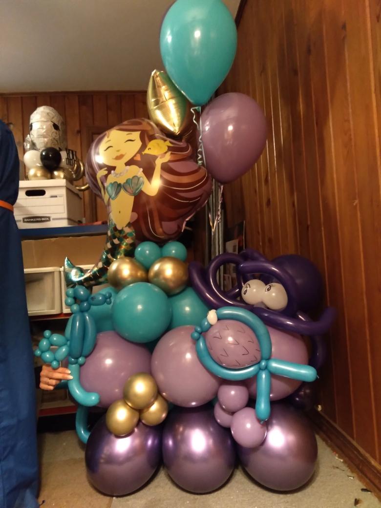 A bunch of balloons are stacked on top of each other
