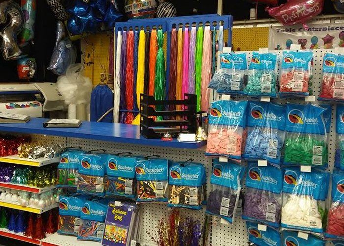 Shelves of balloons and ribbon in a party supply store
