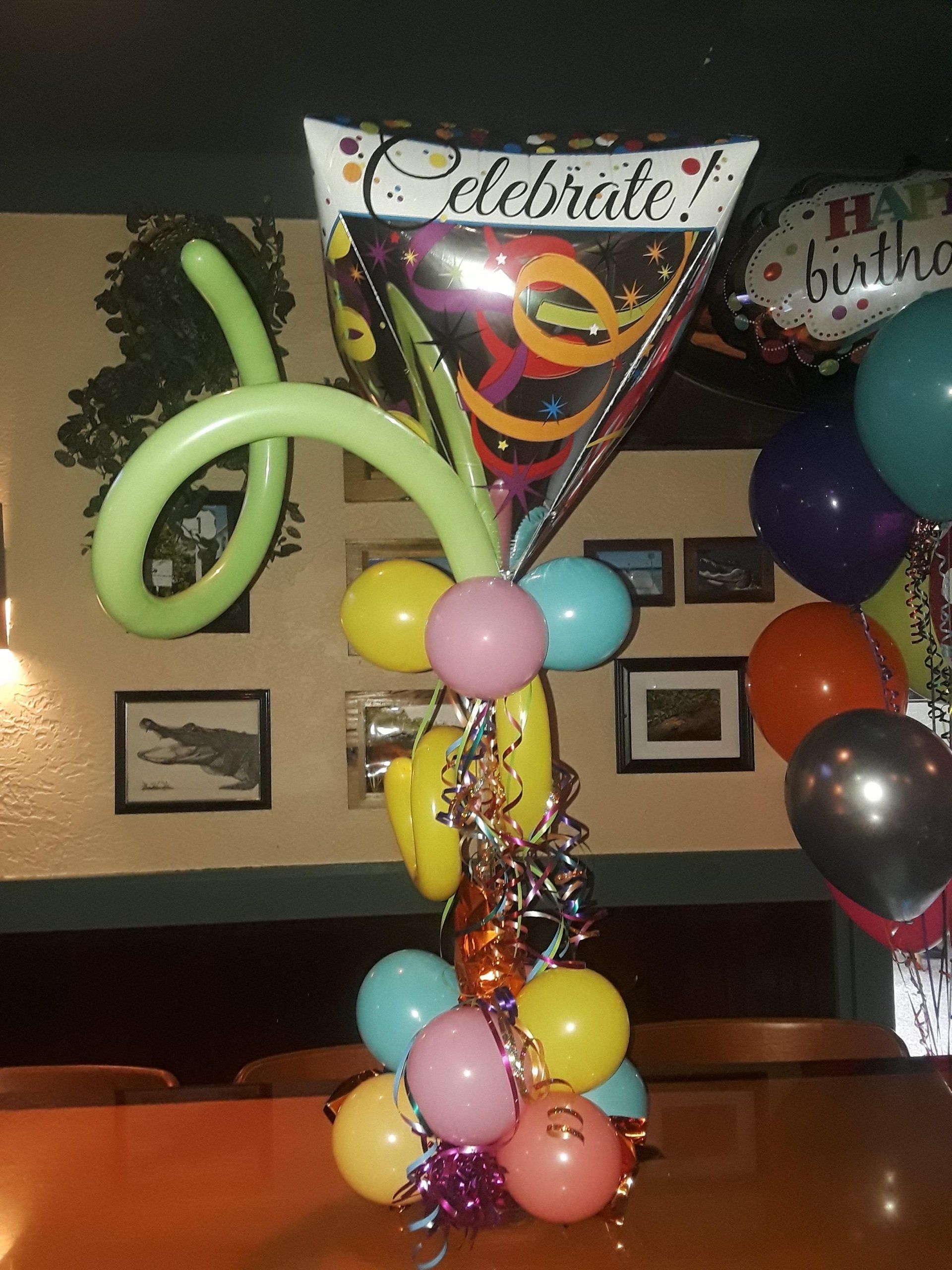 Grouping with long green swirl balloon