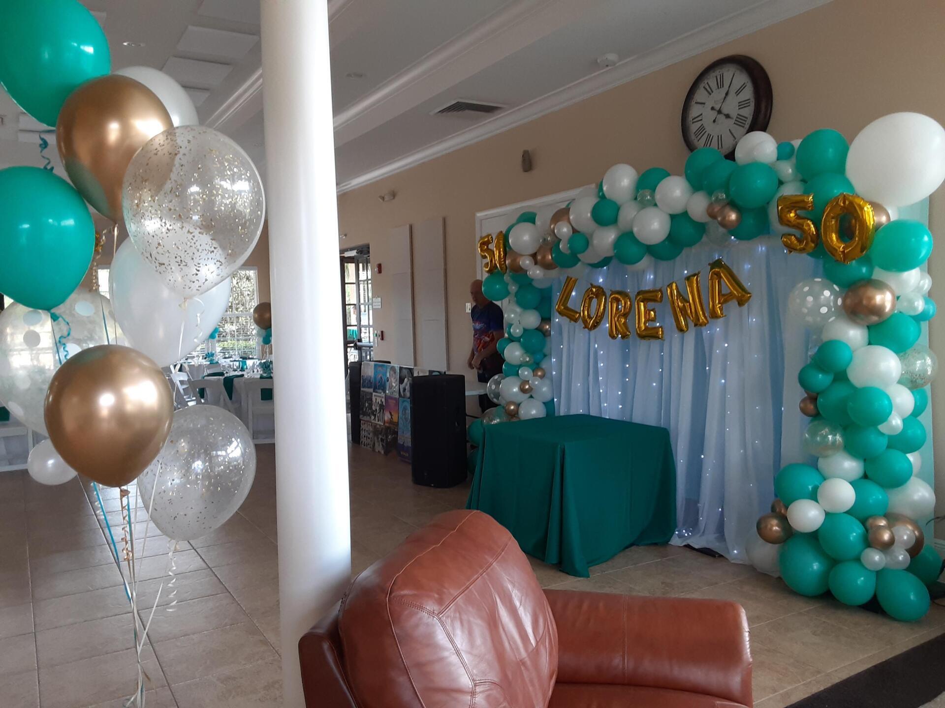 A room filled with balloons and a chair.