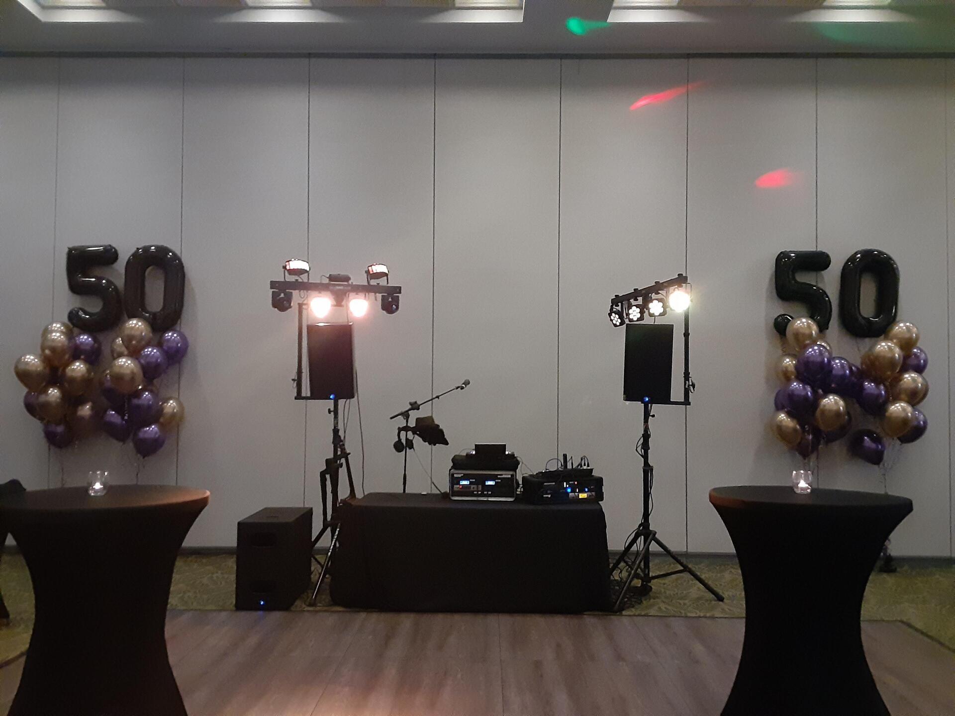 A room with balloons and the number 50 on the wall