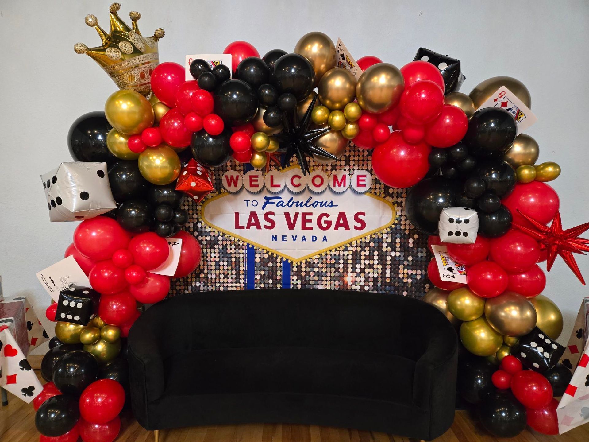 A couch is sitting in front of a sign that says welcome to las vegas.