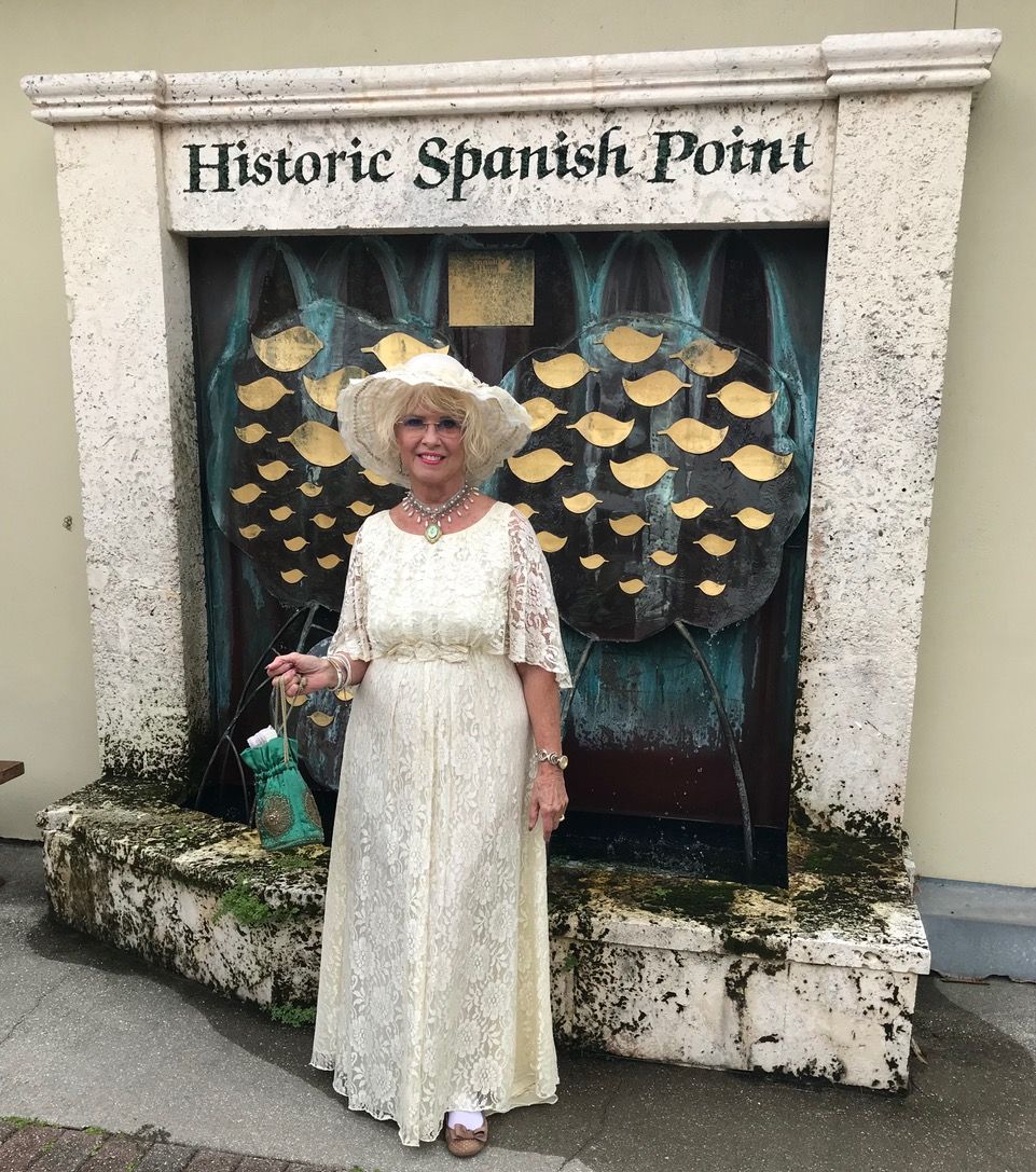 white lace dress with white hat