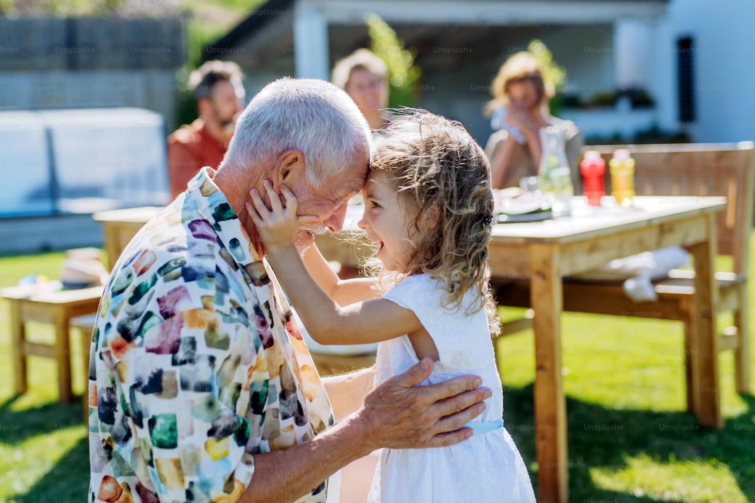 An outdoor family gathering with multiple generations.