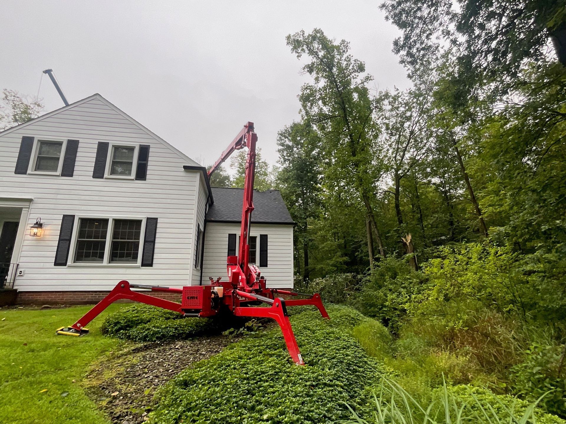 tree removal equipment behind house