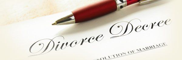 A divorce decree document and a pen