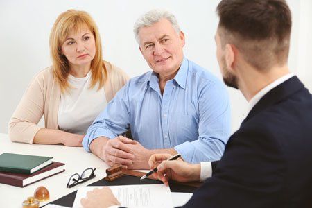 Couple meeting with a family law attorney