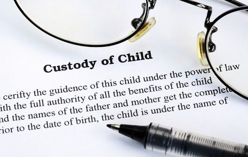 torn page from book of definition of child custody