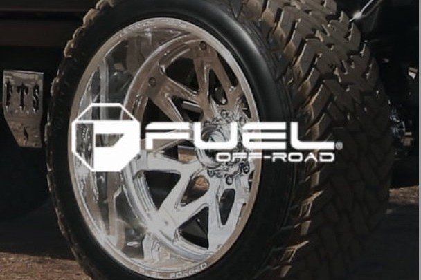 Chrome off-road wheel on a rugged tire with Fuel Off-Road logo overlay