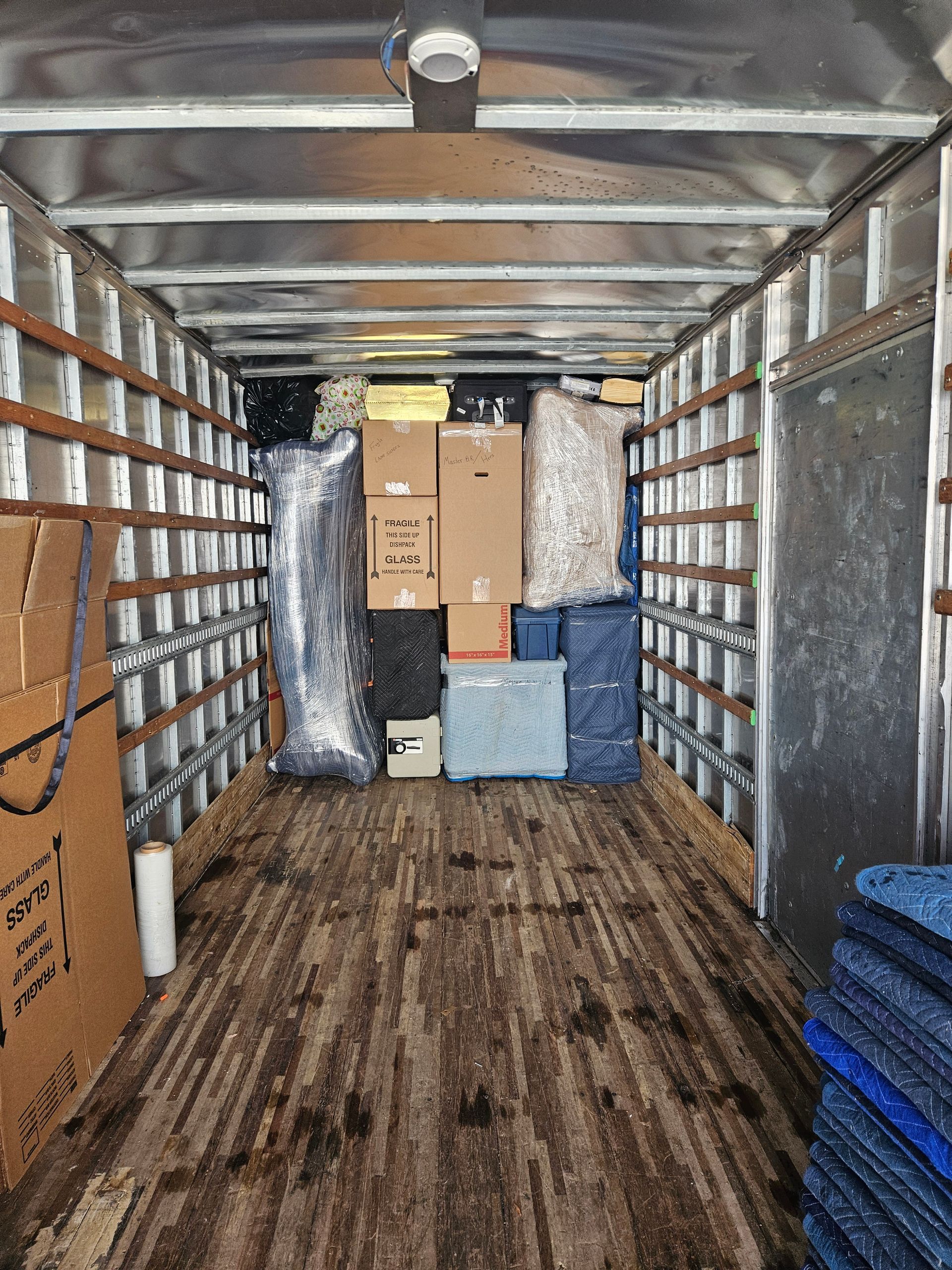 Long view of boxes in a moving van.