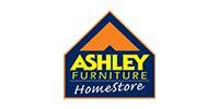 Ashley Furniture Homestore logo with a blue and gold house-shaped emblem.