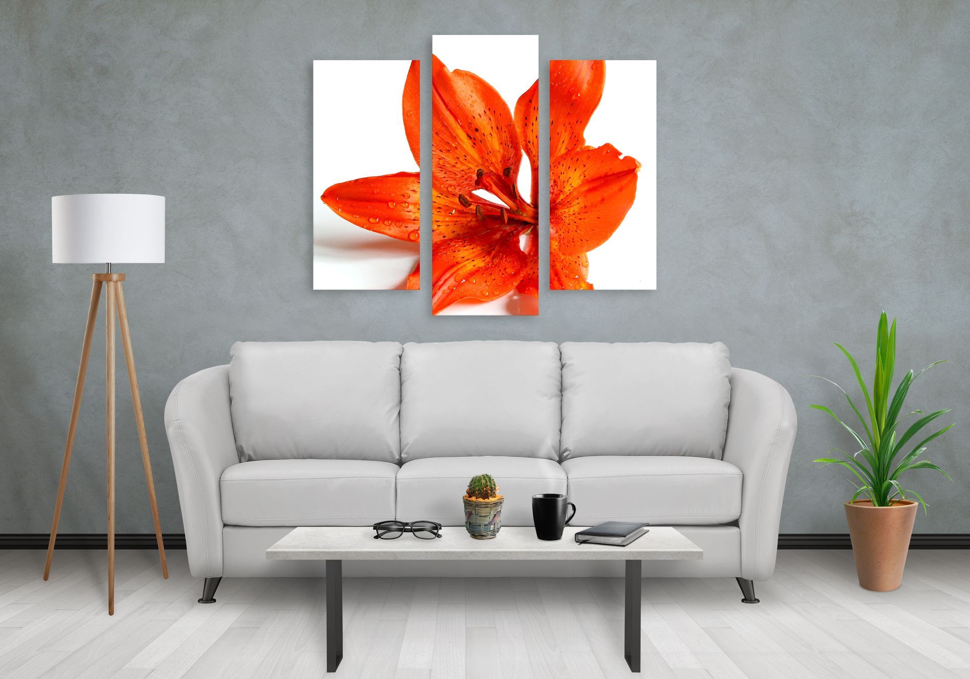 Modern living room with gray sofa, coffee table, floor lamp, potted plant, and red flower wall art