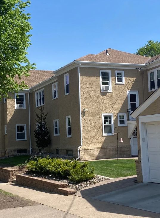 A house with a garage and a lot of windows.