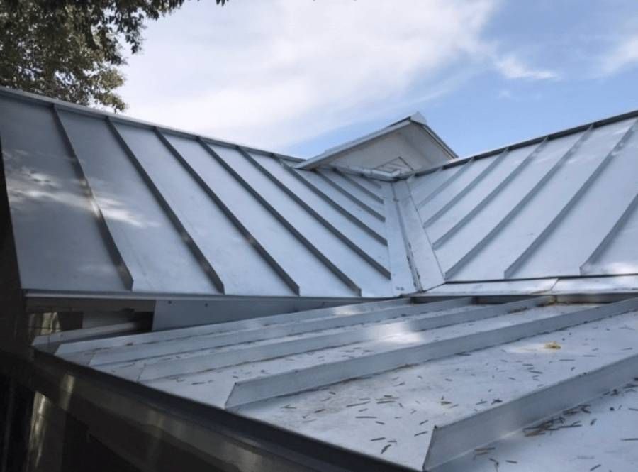 A white roof with a blue sky in the background