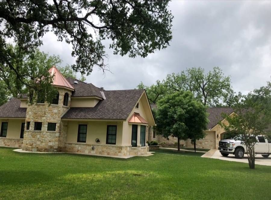 A large house with a truck parked in front of it