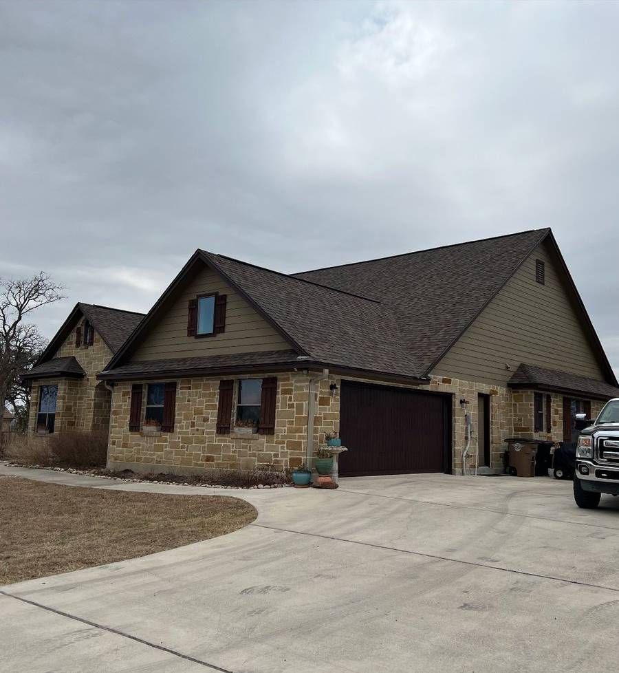 A large house with a truck parked in front of it