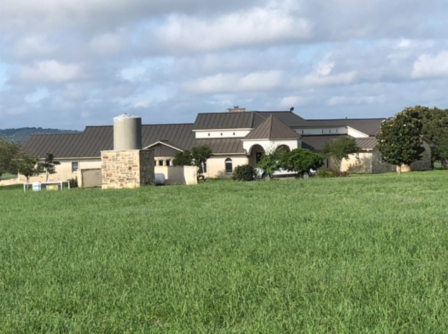 A large house with a metal roof