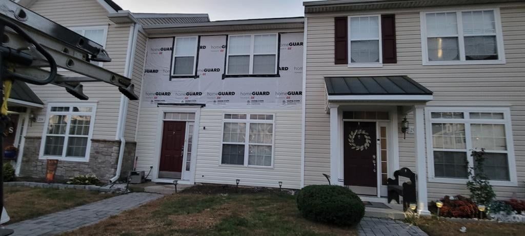 A house with a lot of windows is being remodeled.