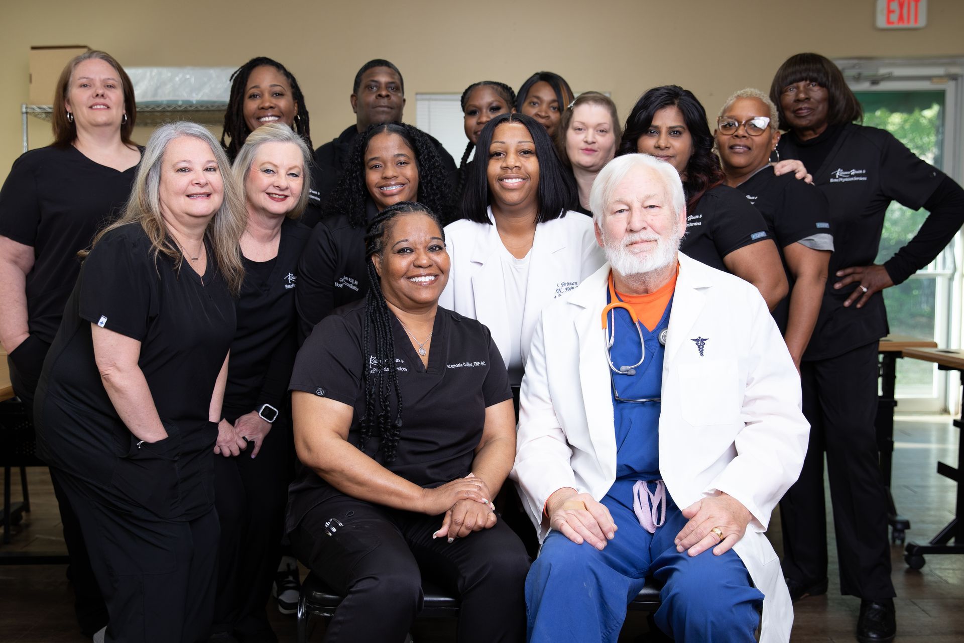 A group of doctors and nurses posing for a picture