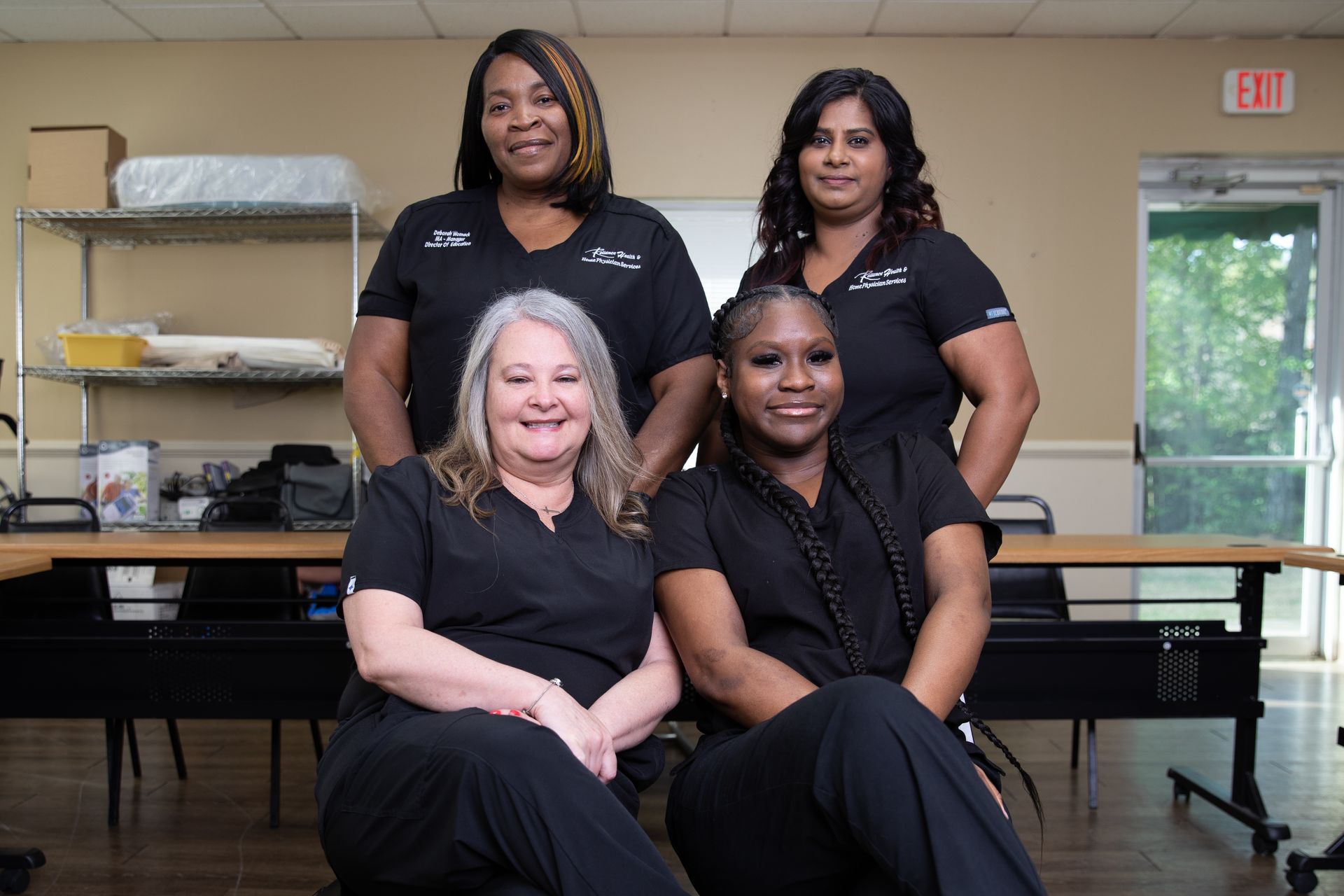 A group of doctors and nurses are posing for a picture.