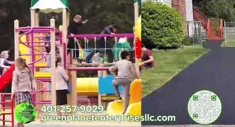 Playground with children, green space, and asphalt path