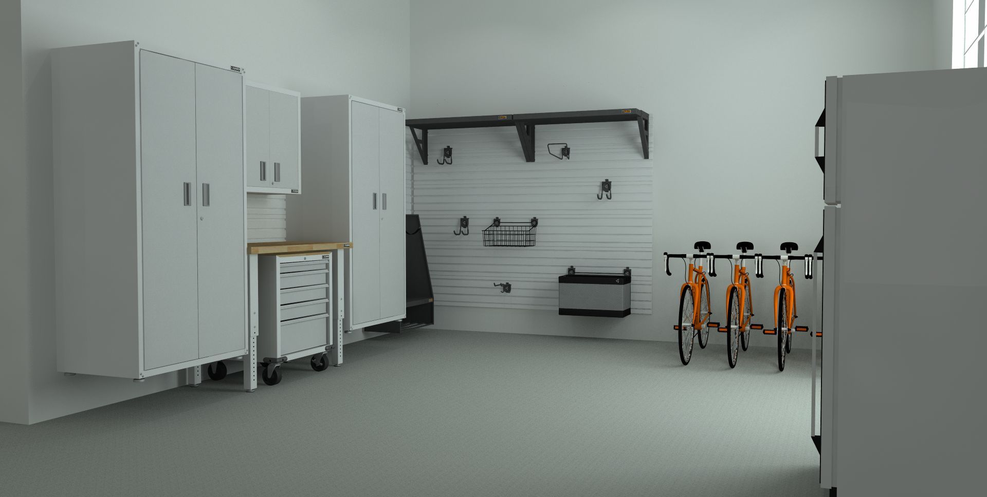 a garage with a lot of white cabinets and bikes hanging on the wall .