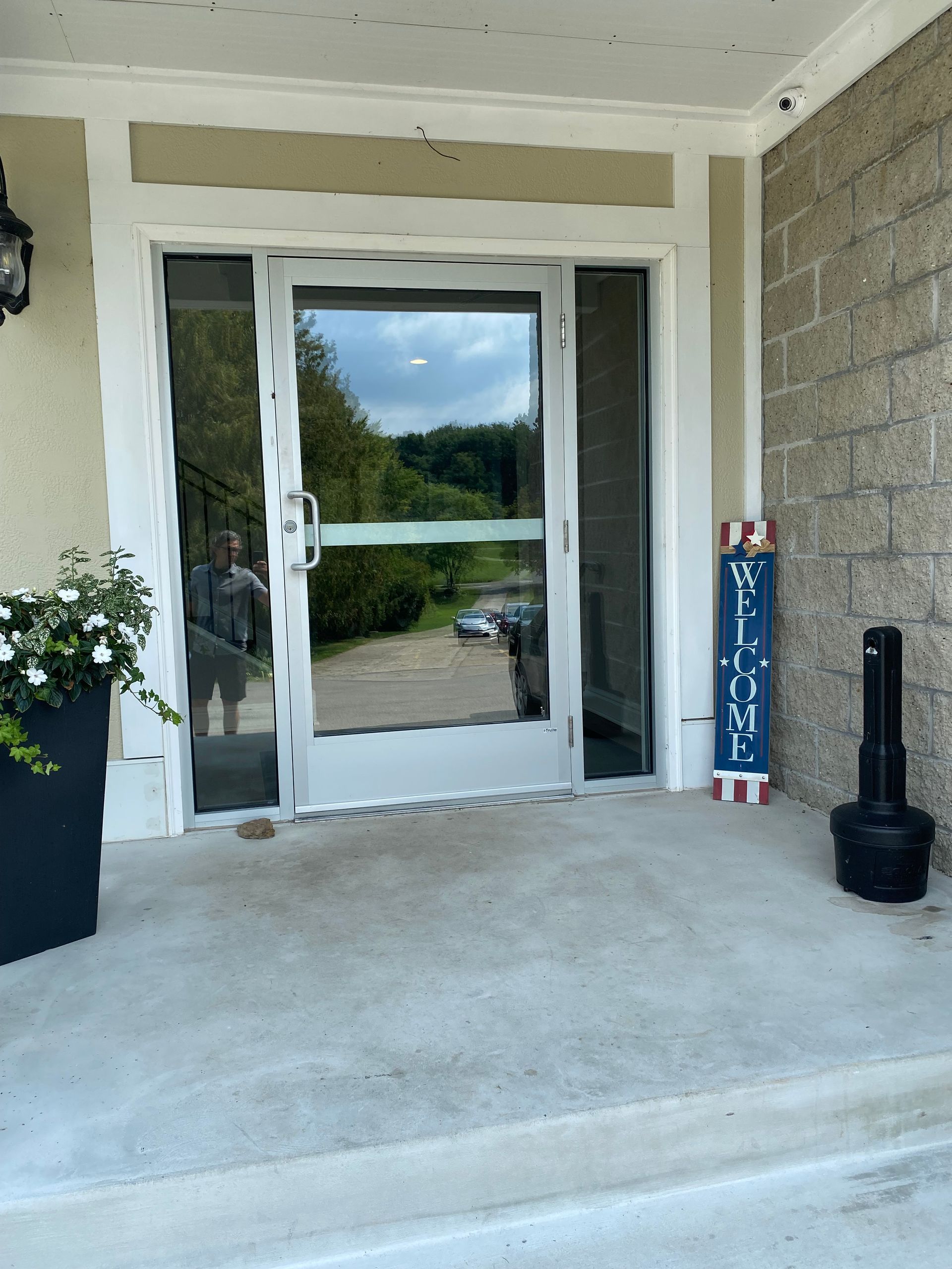 A glass front door with a white frame, a 
