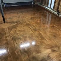 A close up of a shiny metallic floor in a garage.