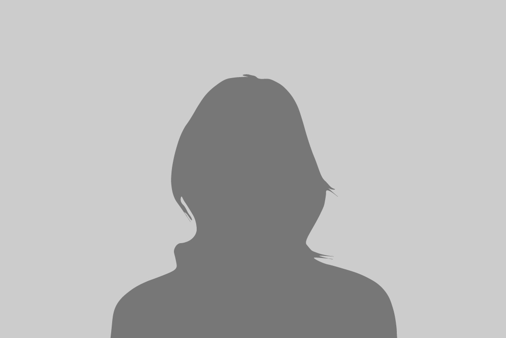 A silhouette of a woman 's head on a gray background.