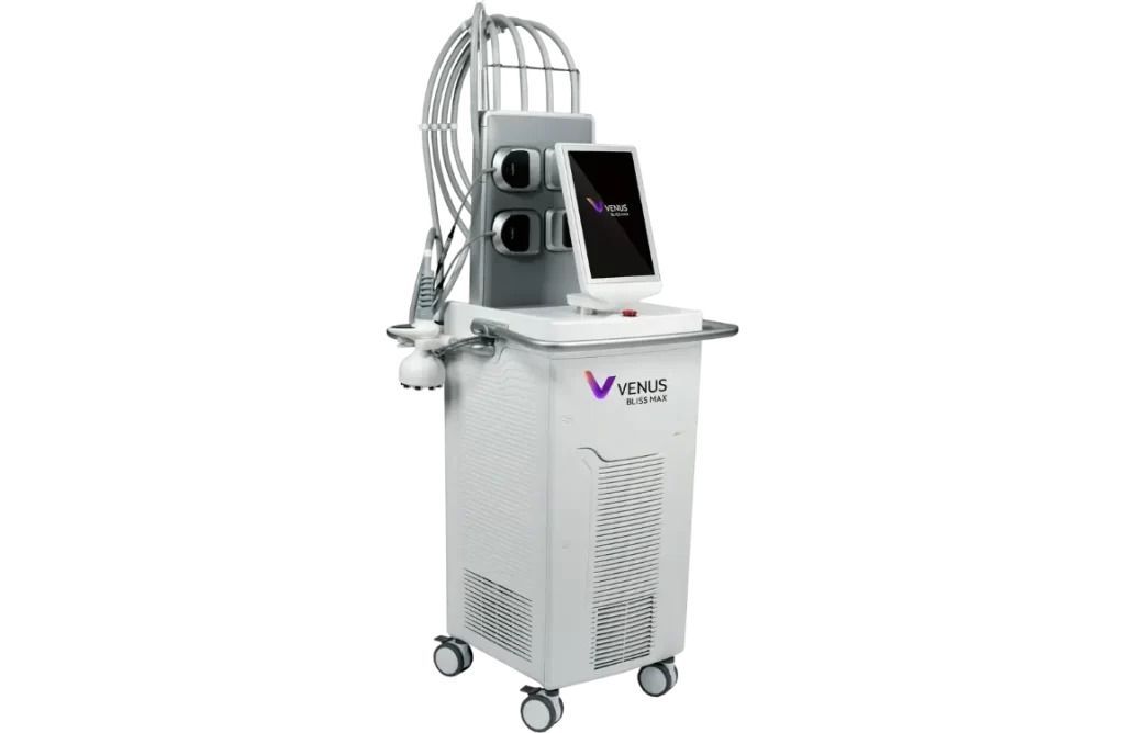 White medical device with a touchscreen interface, cables, and attachments on wheels.