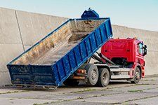 Learn More About Roll-Off Containers Roll-off container on truck