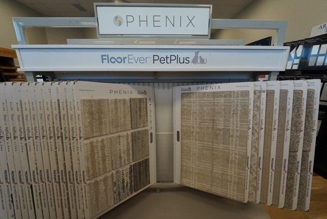 a display of floor-ever pet plus carpets in a store.