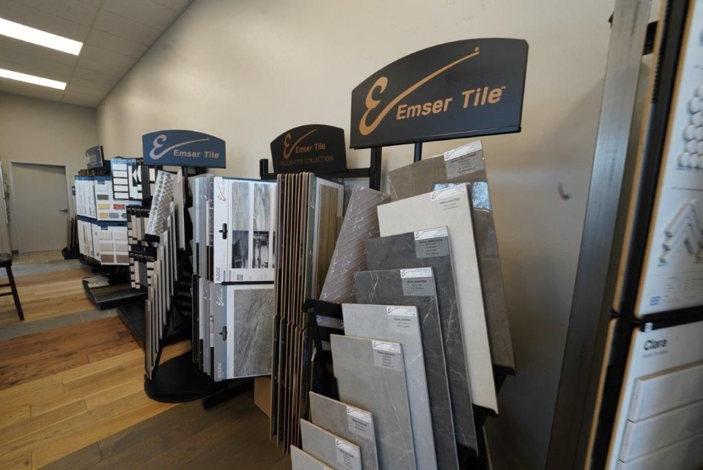 a display of tiles in a store with a sign that says 'Emerson tile ' on it.