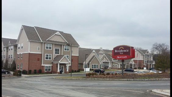 A building with a red sign in front of it