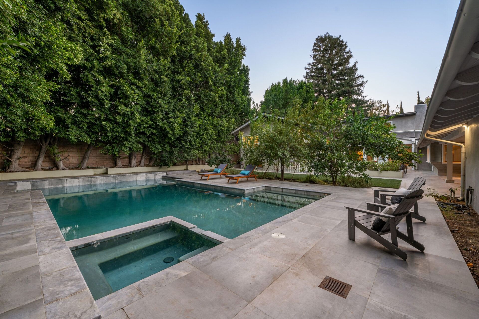 Eco-friendly pool designs featuring a geometric design set in to a vast stone patio.