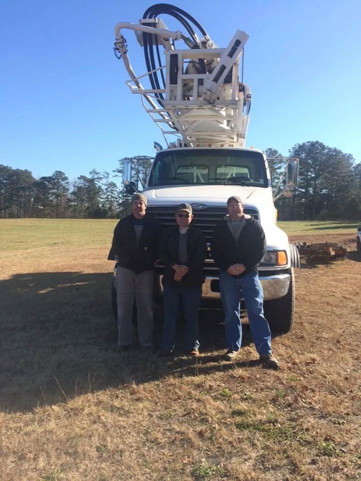 well drilling truck with people