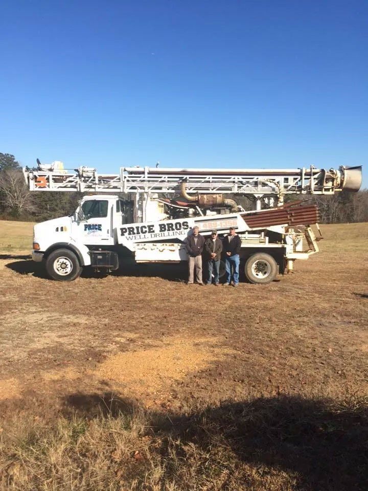 well drilling truck with people