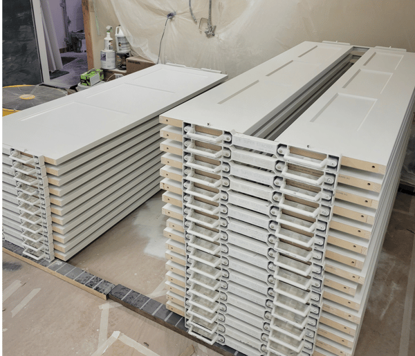 A stack of white shelves sitting on top of each other