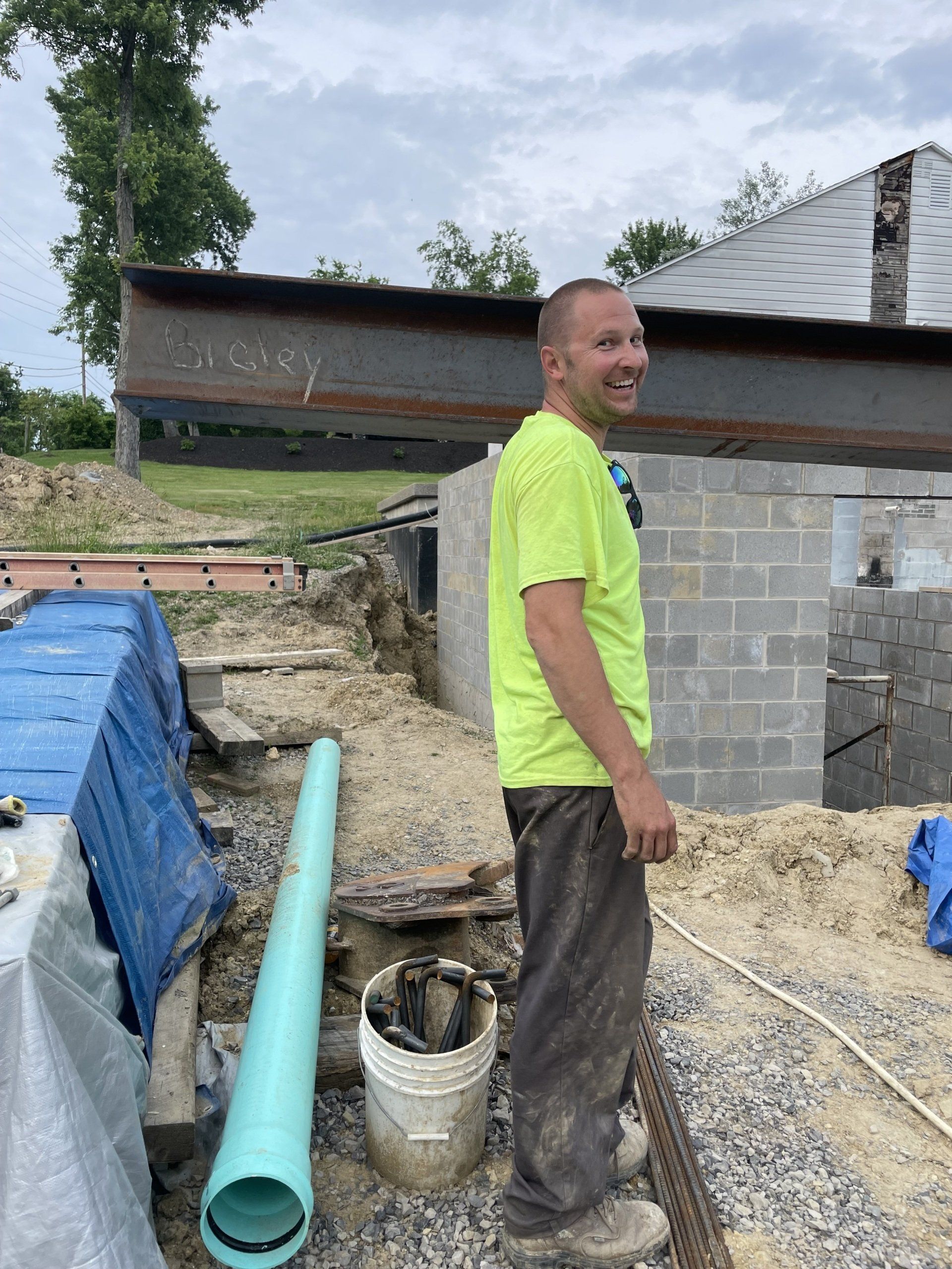 Smiling man in green shirt