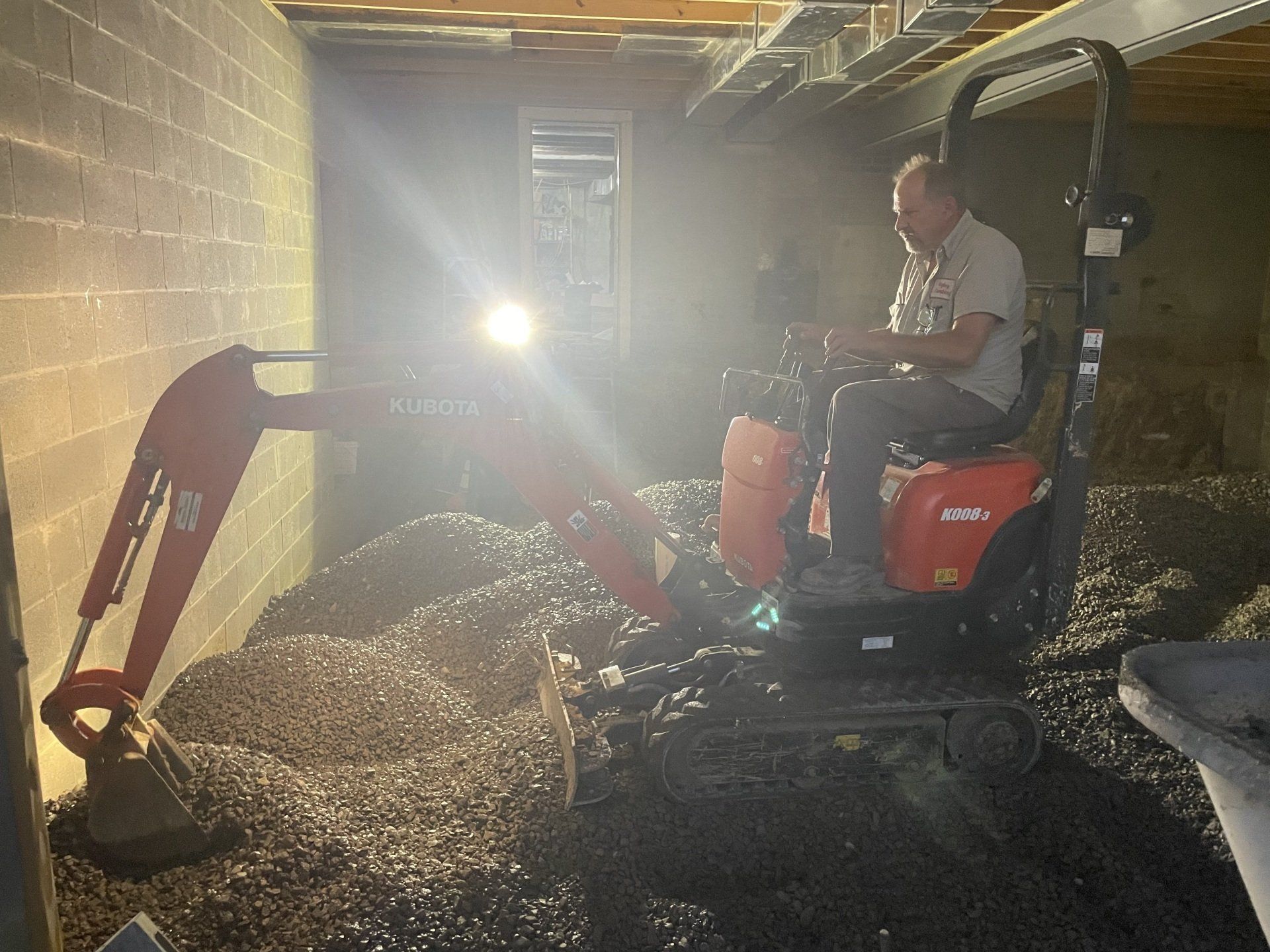 Man working using Kubota machine