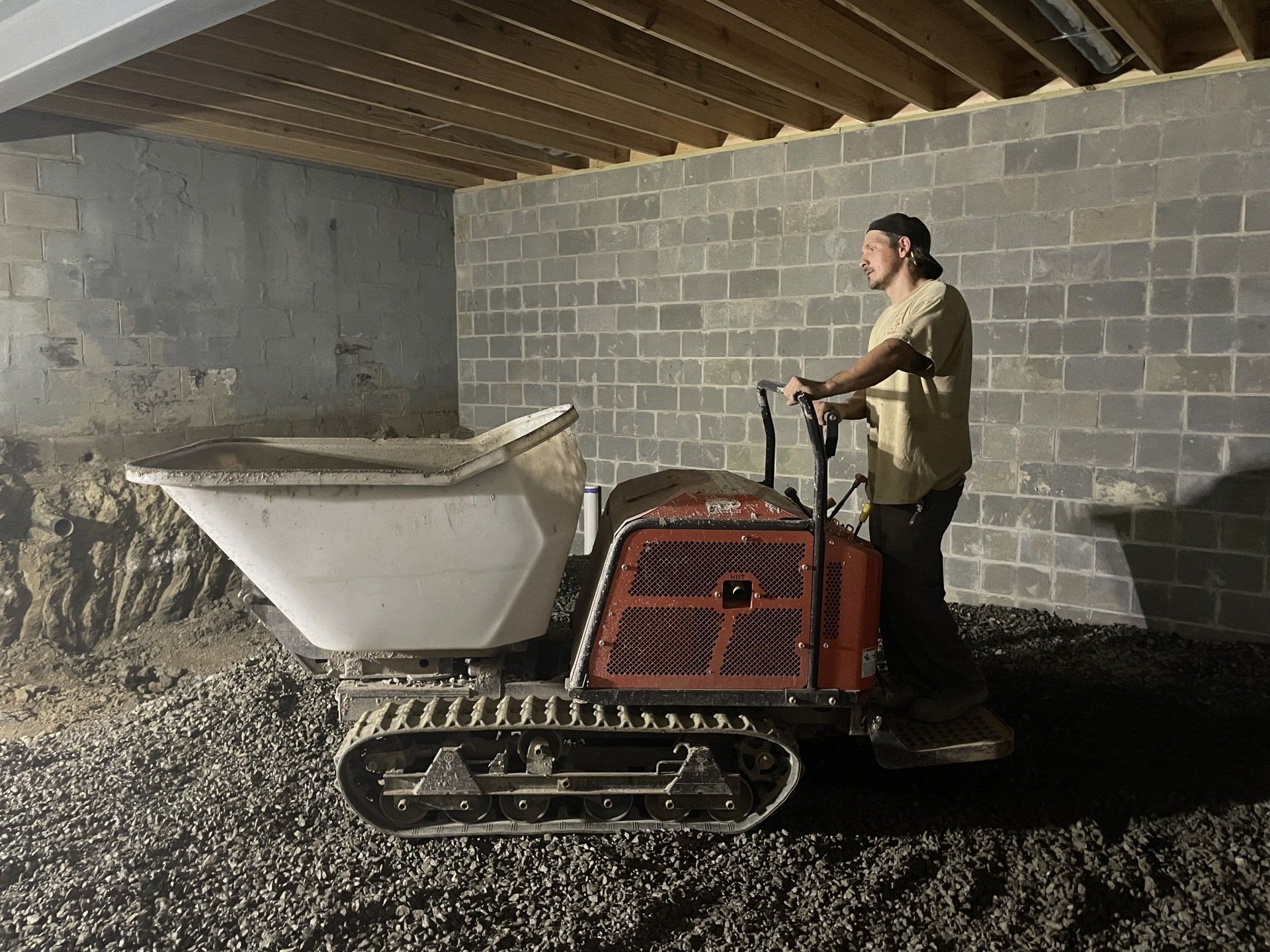 Man in cream shirt waiting for his turn to work