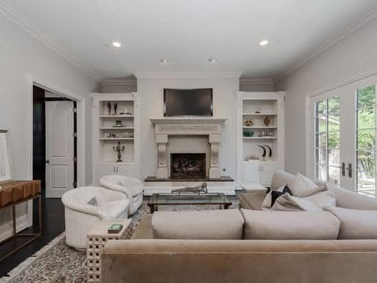 A living room filled with furniture and a fireplace