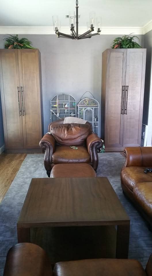 A living room filled with furniture and a chandelier