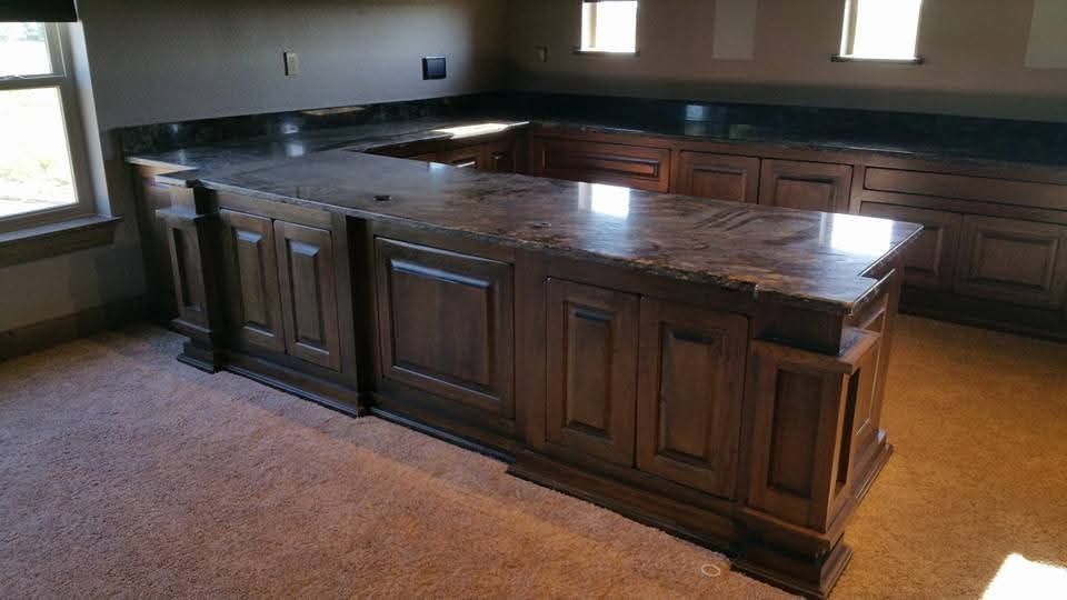 A kitchen with a large island in the middle of the room