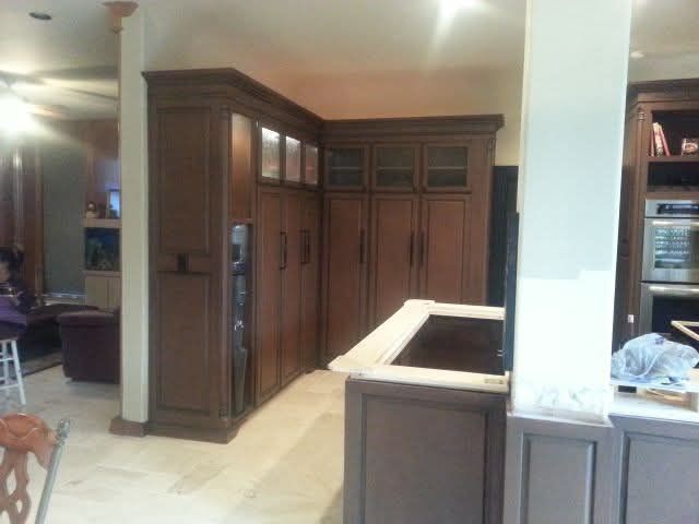 A kitchen with lots of cabinets and a sink