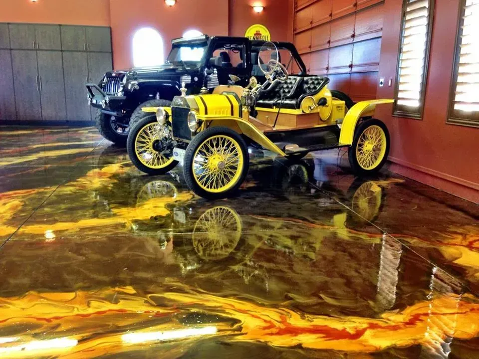 Vintage yellow car indoors on a glossy floor, reflecting lights in a dim garage or showroom