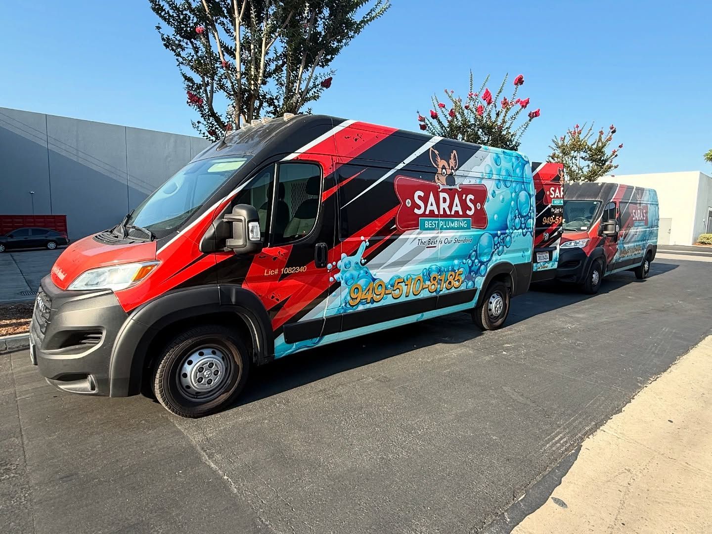 Two vans with water-themed wrap advertising 