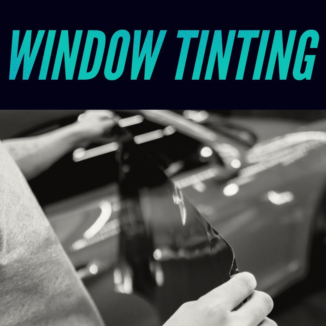 Window tinting text over black and white photo of person applying tint to a car window.