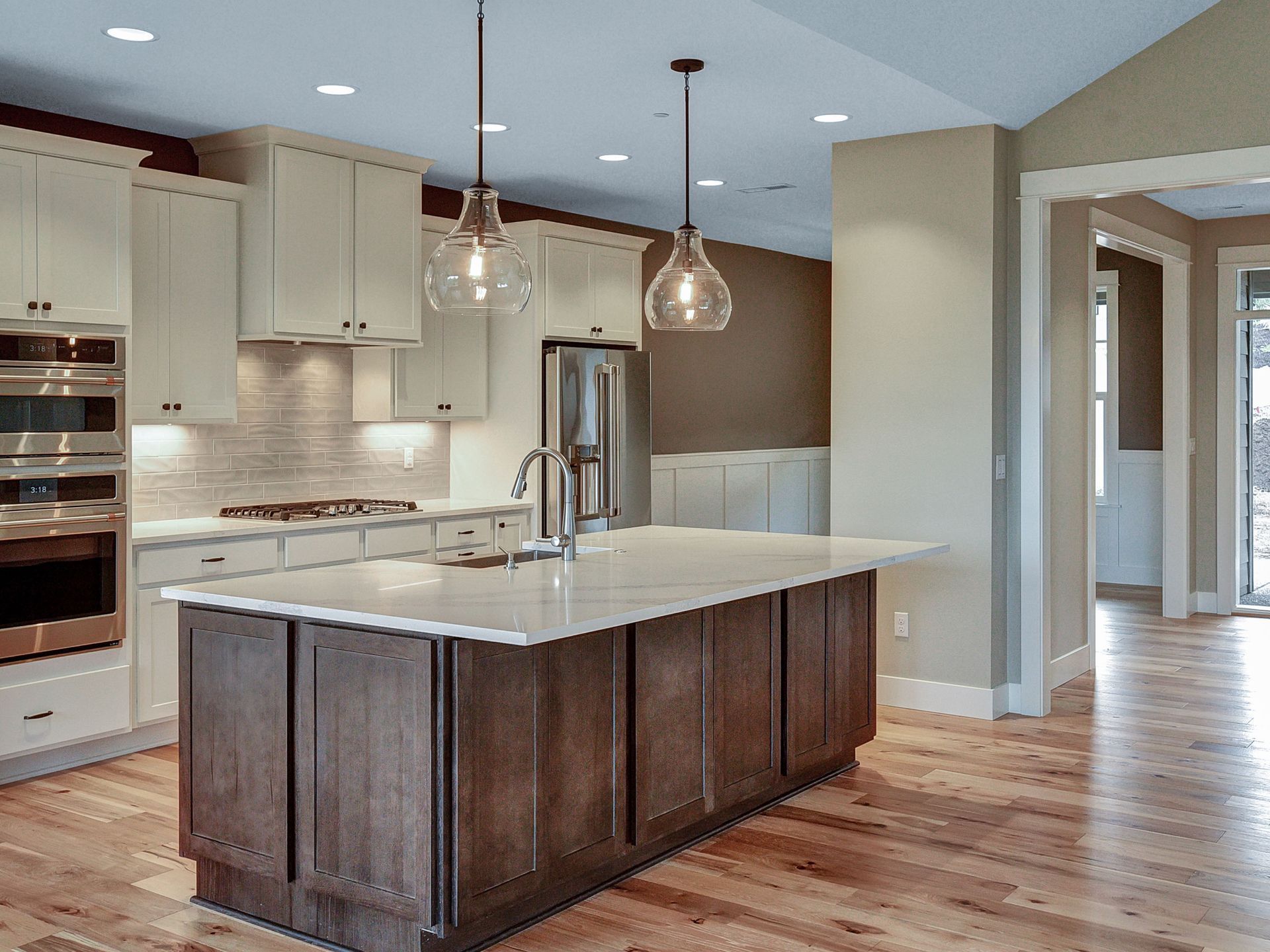 A kitchen with a large island in the middle