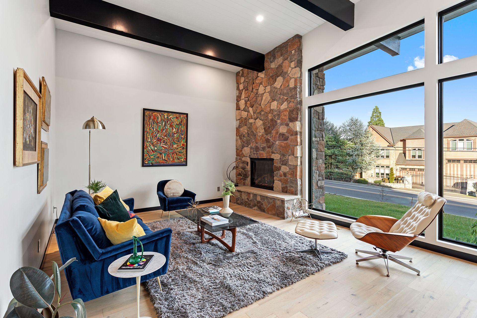 A living room with paintings